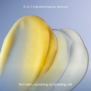 Three textured swatches—yellow, pearly white, and translucent—overlap on a pale background. Text reads: “3-in-1 transformative texture. Rich balm, nourishing oil, hydrating milk.” Experience the multi-tasking power of ELEMIS - PRO-COLLAGEN GREEN FIG CLEANSING BALM by ELEMIS - STEINER—a luxurious facial cleansing balm that also acts as an effective makeup remover.