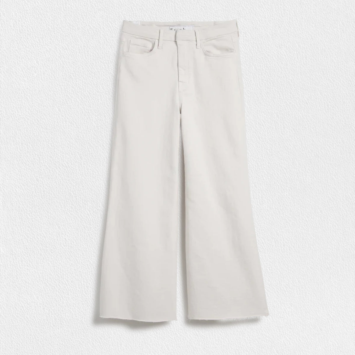 A pair of wide-leg fit jeans in a natural color from FRANK &amp; EILEEN&#39;s GALWAY GAUCHO JEAN collection is displayed against a white textured background. Dubbed the Italian Dream Denim, these jeans feature a high waist, two front pockets, and two back pockets, with belt loops and a button and zipper closure.