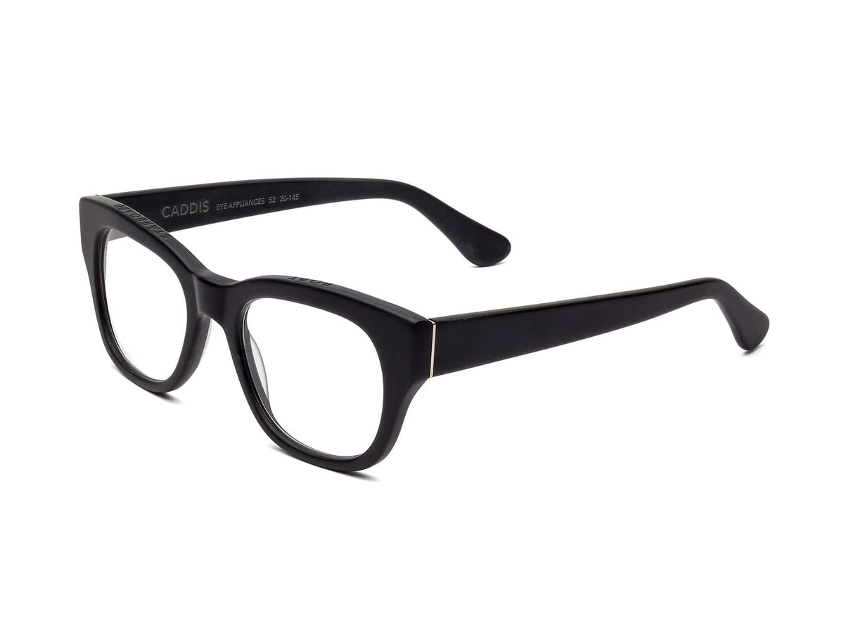 CADDIS - MIKLOS READERS by CADDIS, featuring black rectangular bio-based acetate frames with a thick design, displayed at an angle on a white background.