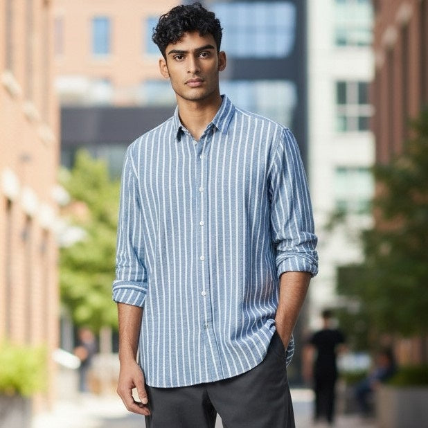 The FRANK &amp; EILEEN Finbar men's button-up shirt in turquoise with white stripes features washed linen, a back view, and long sleeves rolled up.
