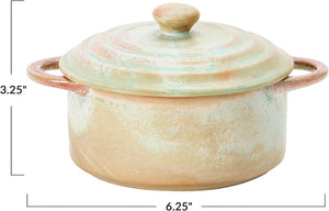 Introducing the MINI STONEWARE BAKER WITH LID by CREATIVE COOP—a rustic, round ceramic pot with side handles and a matching lid. Crafted in striking blue-green and brown hues, this mini baker features a reactive crackle glaze for distinctive texture. The lid is topped with an easy-to-grip knob handle, making it ideal for serving individual casseroles in style.