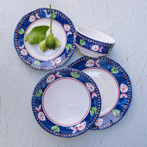 The VIETRI Melamine Campagna Pasta Bowl features a red interior with playful pig and fruit designs, a blue patterned edge, and a durable white melamine build—perfect for outdoor dining.