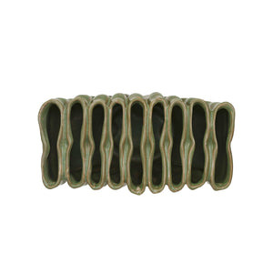 The CREATIVE COOP STONEWARE SCULPTURAL VASE WITH 9 SECTIONS is a matte green vase with a wavy, ridged design and uneven rim, measuring 4.75" tall by 8" wide—an eye-catching modern accent for your décor.