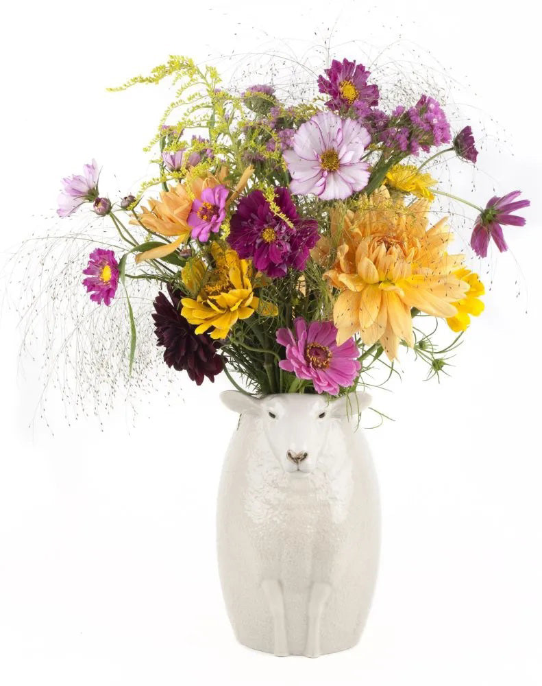 The QUAIL DESIGNS WHITE SUFFOLK SHEEP FLOWER VASE features textured white ceramic fur, upright ears, and a calm expression, shown against a plain white background—a charming piece for any décor.