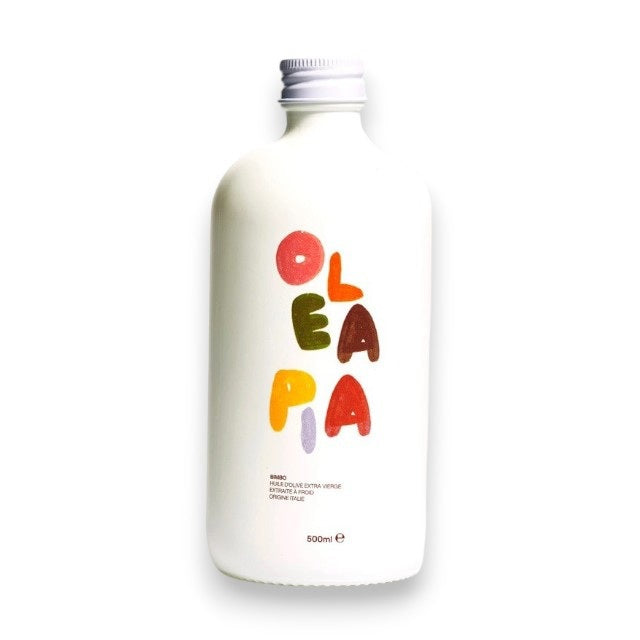 A white bottle labeled “OLEA PIA” in colorful letters, topped with a white cap and showcasing a minimal design, contains 500ml of OLEA PIA - BIMBO LIGURIAN OLIVE OIL—premium Italian olive oil crafted for exceptional taste and quality.
