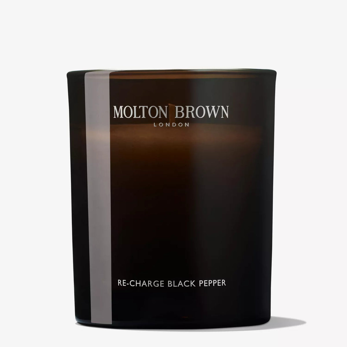 A dark brown glass MOLTON BROWN - RE-CHARGE BLACK PEPPER CANDLE with vetiver notes sits on a plain white background, featuring the MOLTON BROWN brand name.