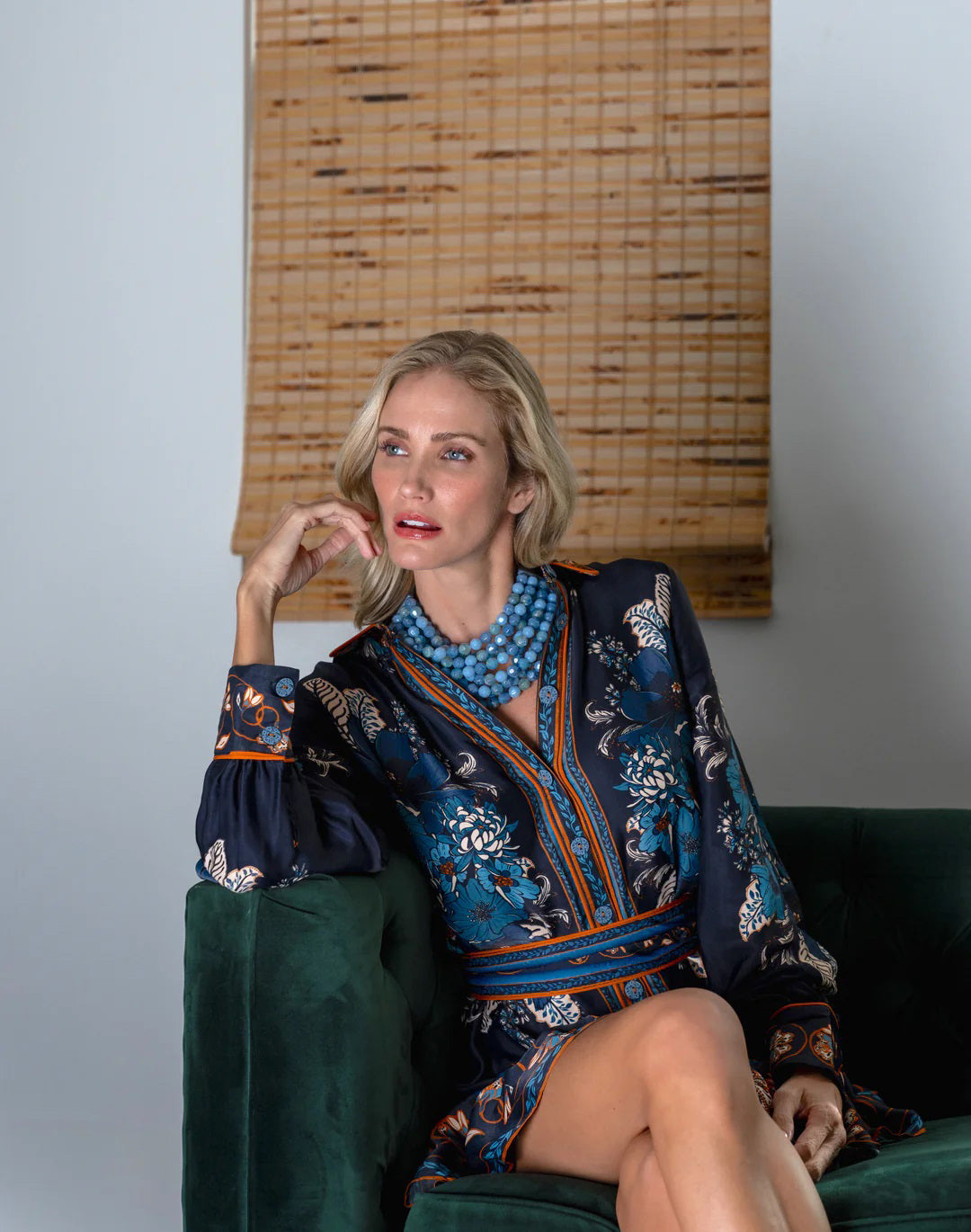 The FAIRCHILD BALDWIN - THE BELLA NECKLACE showcases layered strands of iridescent green Italian resin beads with a faceted design for a shimmering effect, finished with a smooth light green clasp that complements its vibrant hues.