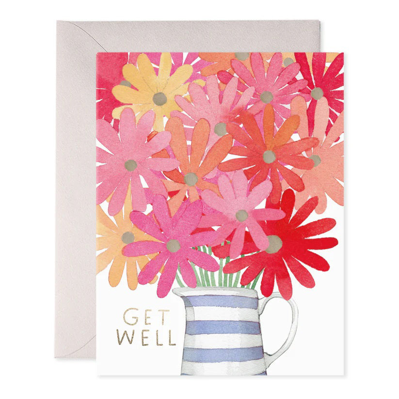 E. FRANCES PAPER's handcrafted GET WELL FLOWERS GREETING CARD features a watercolor bouquet of daisies in pink, red, and orange in a blue and white striped vase. The card has "Get Well" with subtle foil accents on the front and comes with an envelope.