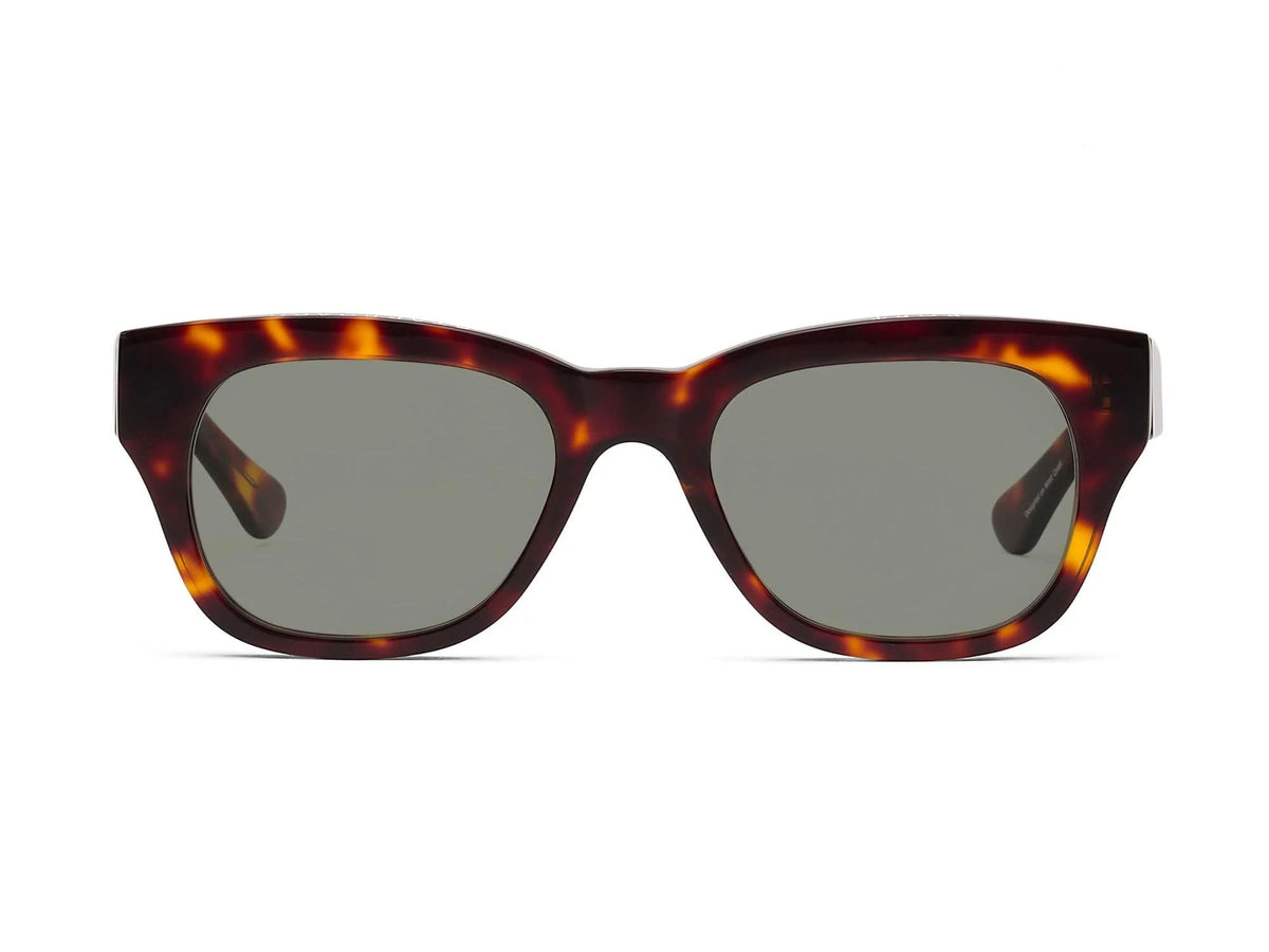 The CADDIS MIKLOS POLARIZED SUNGLASSES feature premium acetate, square dark scratch-resistant lenses, and a thick tortoiseshell frame, shown against a white background.