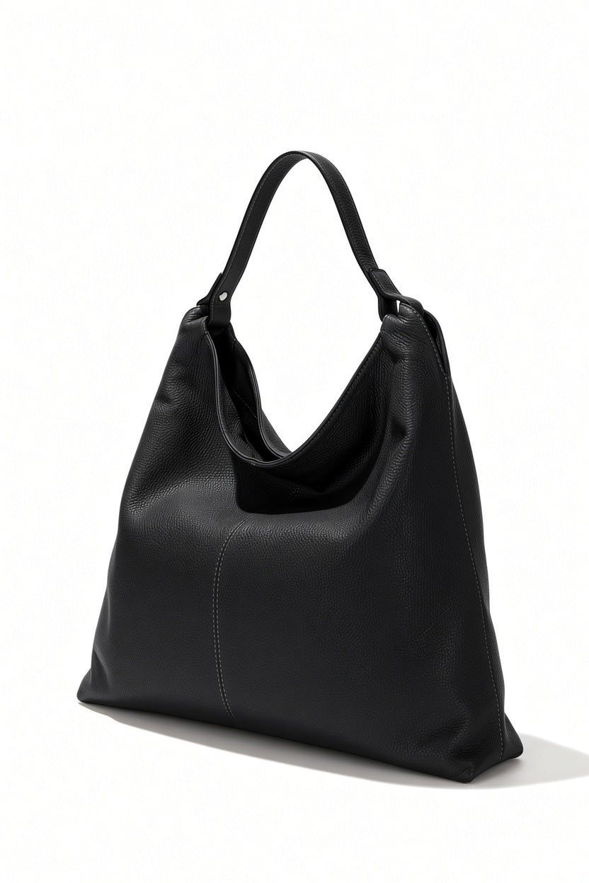 LE BORSETTE ITALIAN LEATHER HOBO STYLE BAG IN BLACK, a black leather hobo bag with a single shoulder strap and a vertical seam down the center.