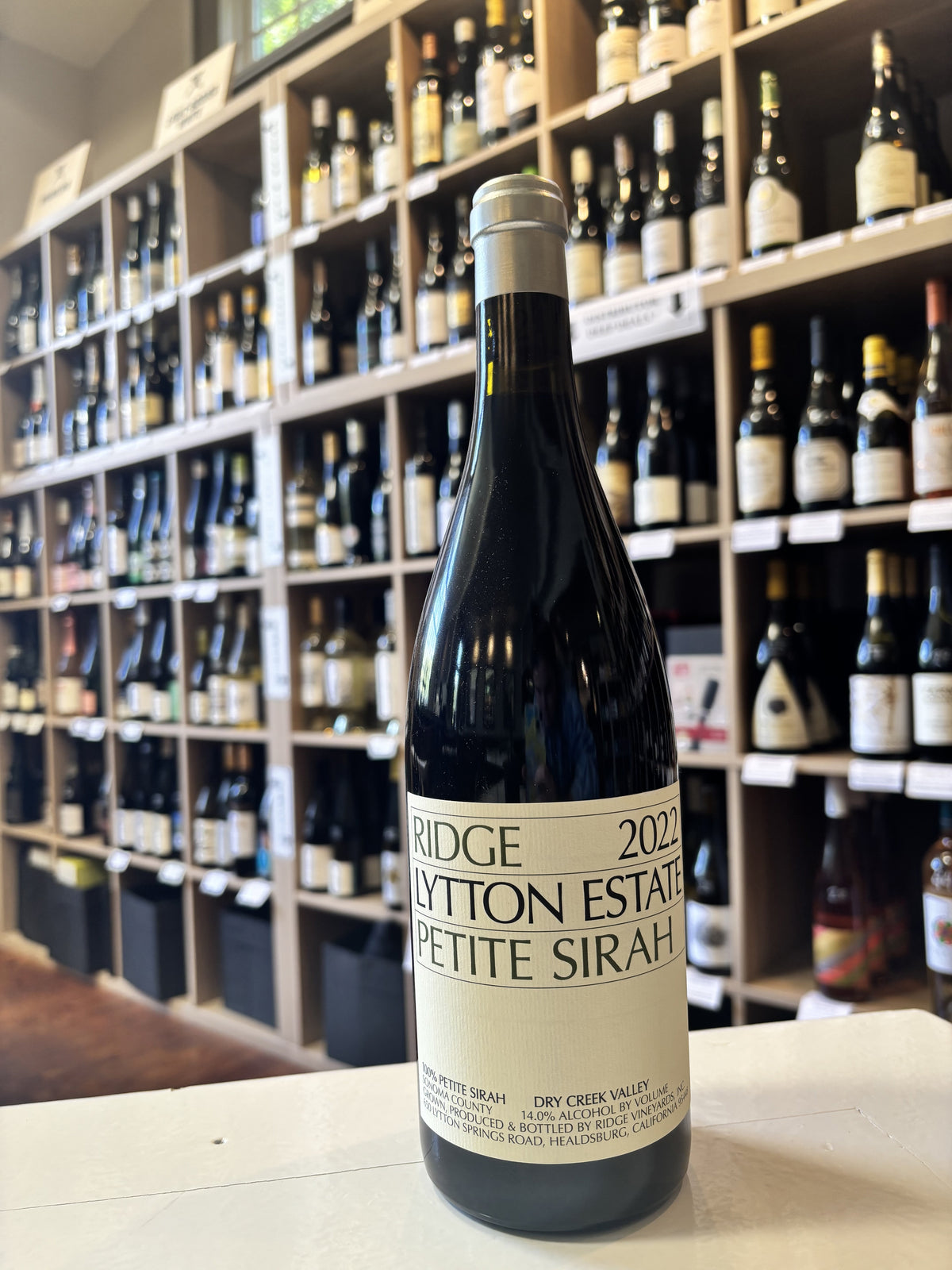 A bottle of RIDGE LYTTON SPRINGS PETITE SIRAH 2022 wine from WINE: WINEBOW, featuring a cream-colored label with black text, set against a plain white background.