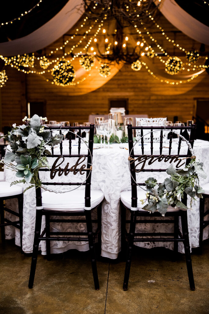 Two black chairs labeled 