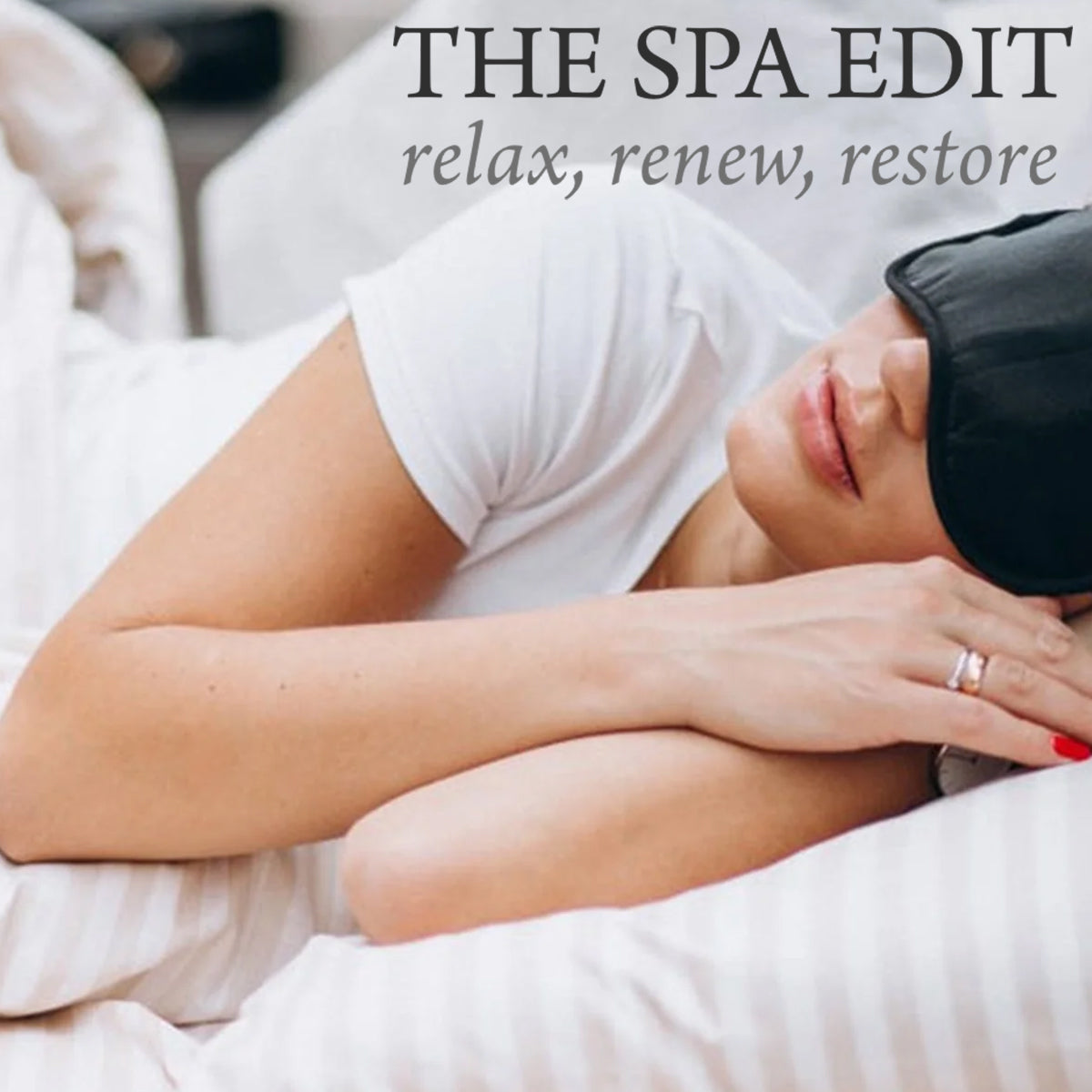 A woman lies in bed wearing a black sleep mask and white shirt, resting her head on striped pillows. Text above reads: "THE SPA EDIT relax, renew, restore.