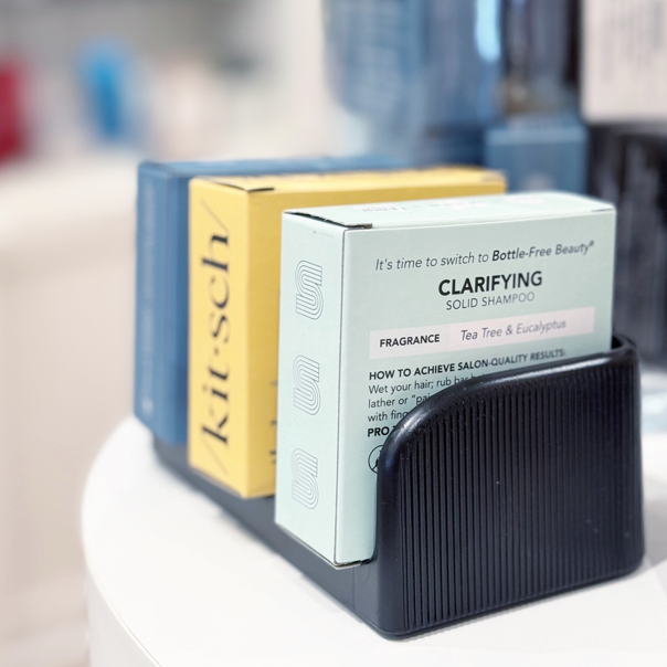 Three boxed hair care products, including a yellow 