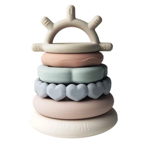 Introducing the SILICONE SUN STACKING RING TOWER from ALI + OLI: a set of BPA-free silicone stacking rings in soft pastel hues. The rings come in various shapes and textures, including hearts, and feature a sun-shaped topper on a sturdy base. This baby development toy is designed to promote motor skills and creativity.