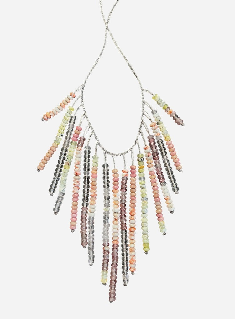 The ANN LIGHTFOOT Multi Gemstone Fringe Necklace features a silver chain with colorful gemstone fringe in pink, yellow, orange, green, and brown—perfect for adding playful charm to any look.