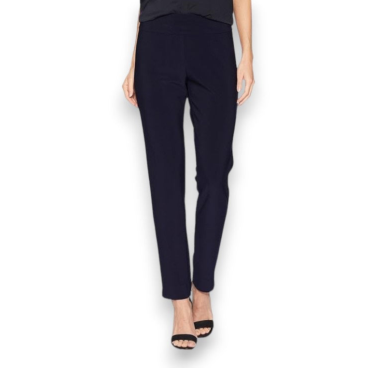 A person is showcased against a white background wearing KRAZY LARRY, INC&#39;s MICROFIBER PULL ON PANT - LONG in a high-waisted design paired with sleek black heeled sandals. Their top and arms are partially visible, contributing to an elegant silhouette.