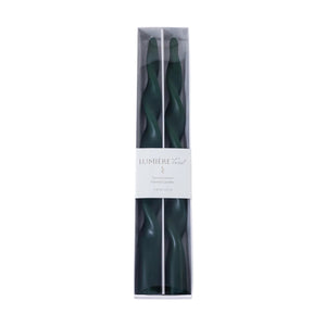 The ZODAX LUMIERE Twist Taper Candles, set of 2 in green, each measuring 0.875 in x 12 in with a 6-hour burn time, are displayed side by side on a white background.