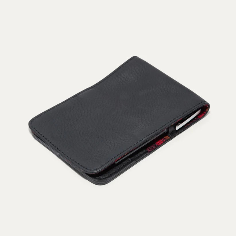 The WILL LEATHER GOODS - GOLF YARDAGE BOOK IN BLACK is shown closed from an angled top view, crafted from subtly textured full-grain leather against a plain white background.
