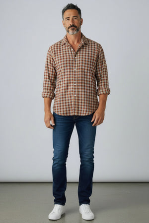 The FRANK & EILEEN Finbar Men’s Button Up Shirt is crafted from premium Italian flannel and features a yellow plaid pattern. This long-sleeve shirt includes a chest pocket, folded collar, and displays the “Frank & Eileen” brand label inside the collar.