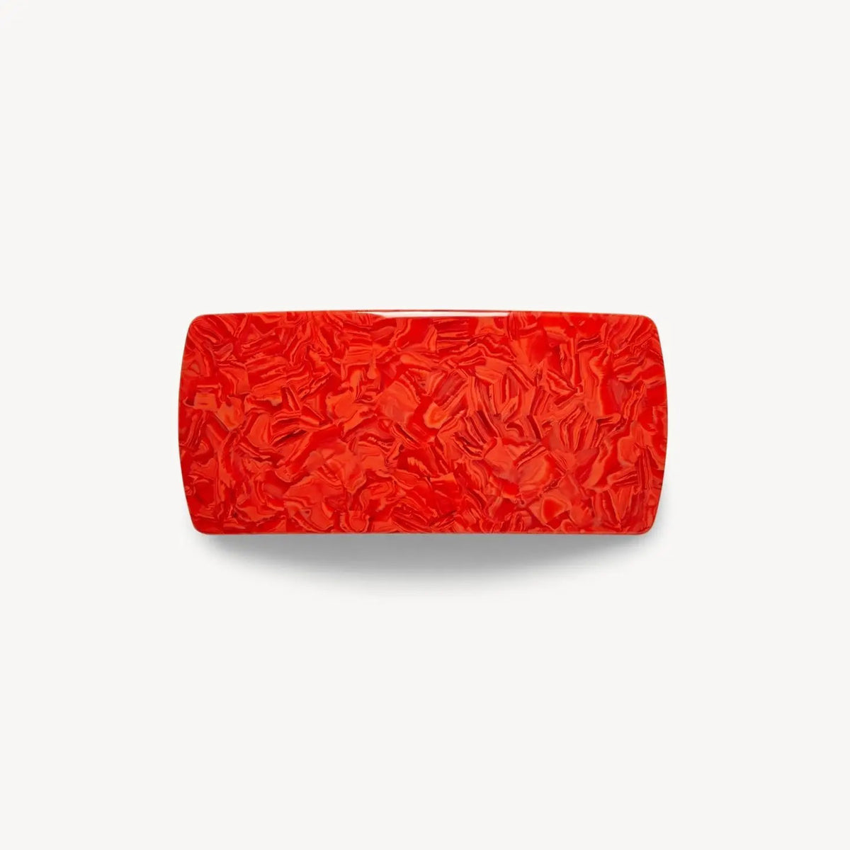 The MACHETE Jumbo Box Barrette in Poppy, a rectangular glossy red Italian acetate hair accessory with a marbled texture, is shown against a plain white background.