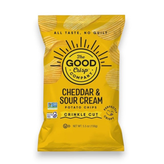 A bright yellow bag of THE GOOD CRISP COMPANY CRINKLE CUT CHEDDAR SOUR CREAM CHIPS showcases bold lettering and a sunburst design. This popular snack boasts gluten-free and non-GMO certifications, making it an ideal pick for Cheddar &amp; Sour Cream fans.