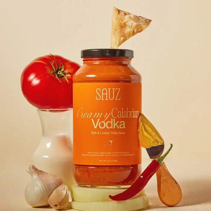 A jar of SAUZ CREAMY CALABRIAN VODKA SAUCE, a creamy, orange-colored pasta sauce.