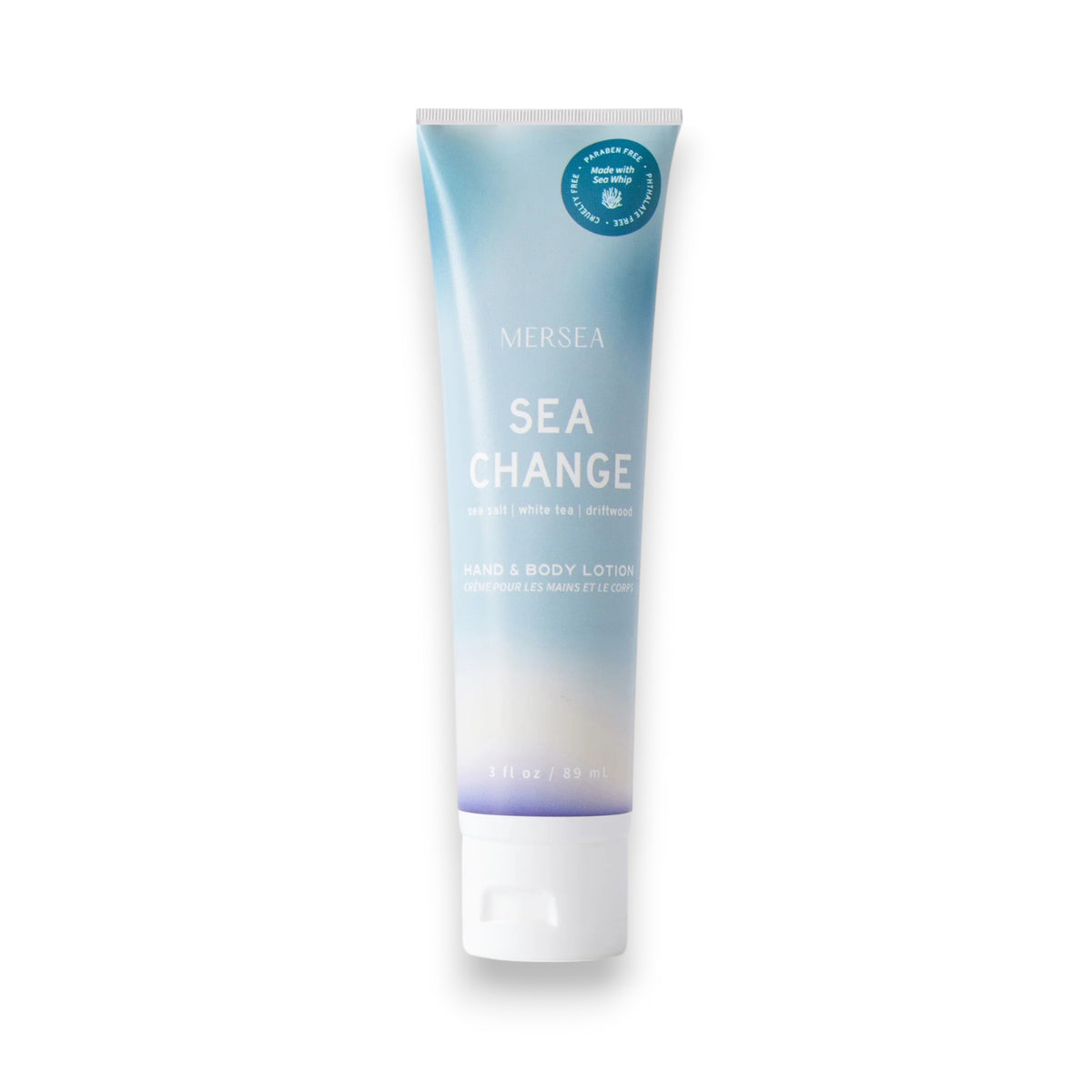 A tube of MERSEA - SEA CHANGE SEA WHIP LOTION, enriched with Dead Sea Salt, stands upright on a white background, featuring a blue and white gradient design and a white cap.