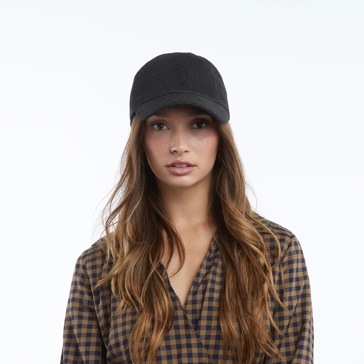 The WYETH HATS - PAULA MESH CAP IN BLACK by WYETH is a black mesh dad cap with a curved brim and UPF 50+ sun protection, shown on a plain white background.