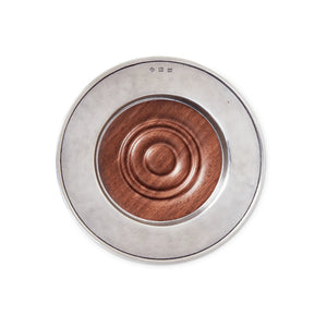 The MATCH - CONVIVIO BOTTLE COASTER WITH WOOD INSERT by MATCH features a round pewter rim and a raised wooden center with concentric circles, shown against a white background.