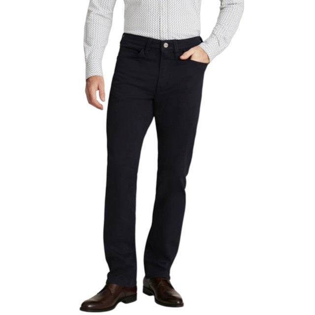A man stands with his arms crossed, wearing a dark gray T-shirt and 34 HERITAGE - CHARISMA RELAXED STRAIGHT PANT IN NAVY TWILL, with only his upper body and waist shown against a plain white background.