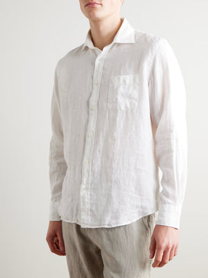 The HARTFORD - PAUL LINEN SHIRT IN WHITE by HARTFORD is a long-sleeved, button-up men's shirt crafted from premium European Flax linen, featuring a collar and single chest pocket, shown flat on a plain light grey background.