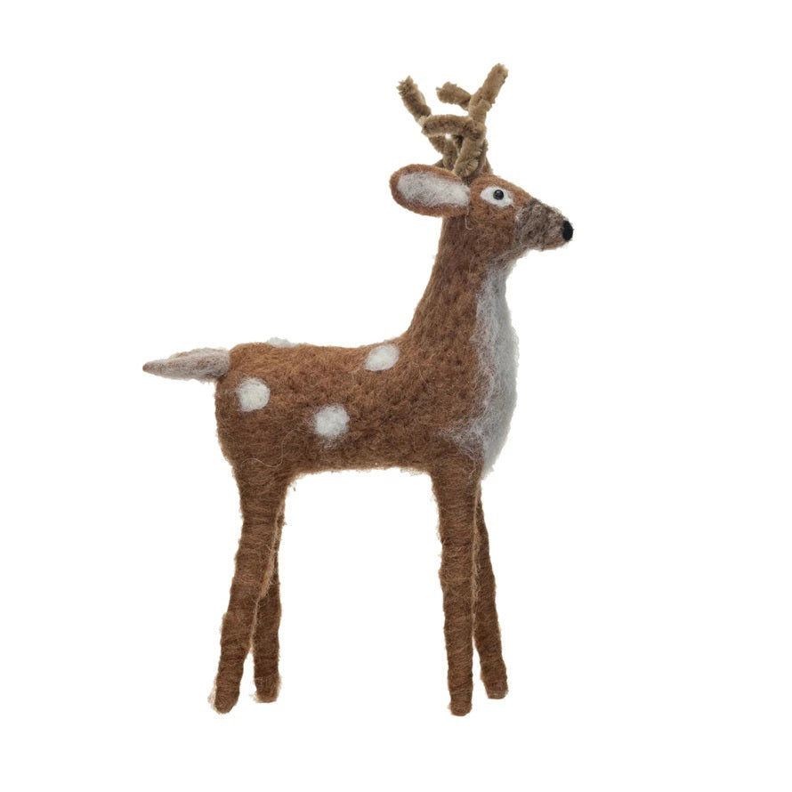 Create a festive scene with CREATIVE COOP FELT STANDING DEER and cream-colored decorative trees with red accents, artfully arranged on a vintage-style box—perfect for seasonal home decor.