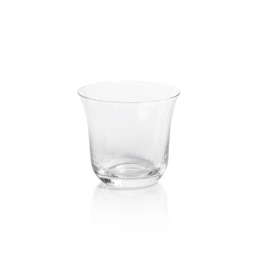 The JULIEN CLEAR OPTIC TUMBLER by ZODAX, featuring a slightly flared top and a thick bottom, sits against a plain white background, showcasing its 320 ml capacity.
