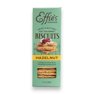 EFFIES - HAZELNUT BISCUIT by EFFIES HOMEMADE comes in a box featuring an image of stacked biscuits topped with jam. The packaging describes them as “crisp & buttery, not too sweet,” and highlights their “layers of oats with roasted hazelnuts.” Enjoy these wholesome biscuits on their own for a satisfying crunch of oats and roasted hazelnuts in every bite, or pair them perfectly with a touch of bittersweet chocolate.