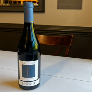 A bottle of PESQUIE ‘QUINTESSENCE’ ROUGE 2022 from WINE: FREEDOM BEVERAGE, featuring a blue and white label and topped with a blue foil capsule, crafted from a blend of Syrah and Grenache.