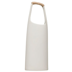The CREATIVE COOP STONEWARE VASE WITH RATTAN WRAPPED HANDLE in white features a tall, minimalist design with a narrow neck and a rattan-wrapped handle, making it a striking decorative accent for any space.
