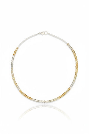 The ANN LIGHTFOOT - FACETED CITRINE RAS DU COU NECKLACE features faceted citrine stones with alternating silver and gold beads in a symmetrical design, secured by a sterling silver clasp, shown on a plain white background.
