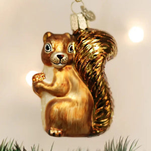 Old World Christmas SQUIRREL ORNAMENT shaped like a squirrel with a bushy tail, holding an acorn.