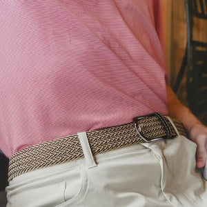 The ROOSTAS TUCSON WOVEN STRETCH BELT features khaki and brown weave, a silver buckle, brown leather accents with stitched logo at the ends for style.