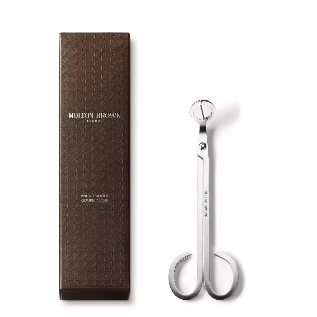 A pair of sleek, chrome-plated wick trimmers with a long handle and scissor-like blades. The MOLTON BROWN - WICK TRIMMER features rounded finger loops and engraved text that reads &quot;MOLTON BROWN&quot; against a white background, perfect for maintaining your scented candles.