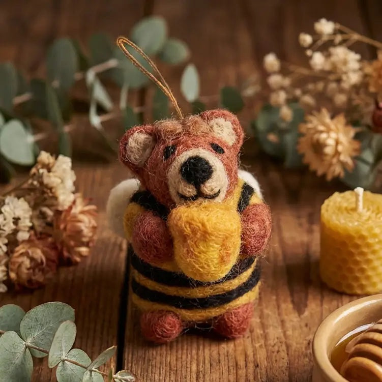 HOWIE HONEY BEE BEAR ORNAMENT handcrafted from needle-felted wool, wearing a striped sweater and holding a honey pot.