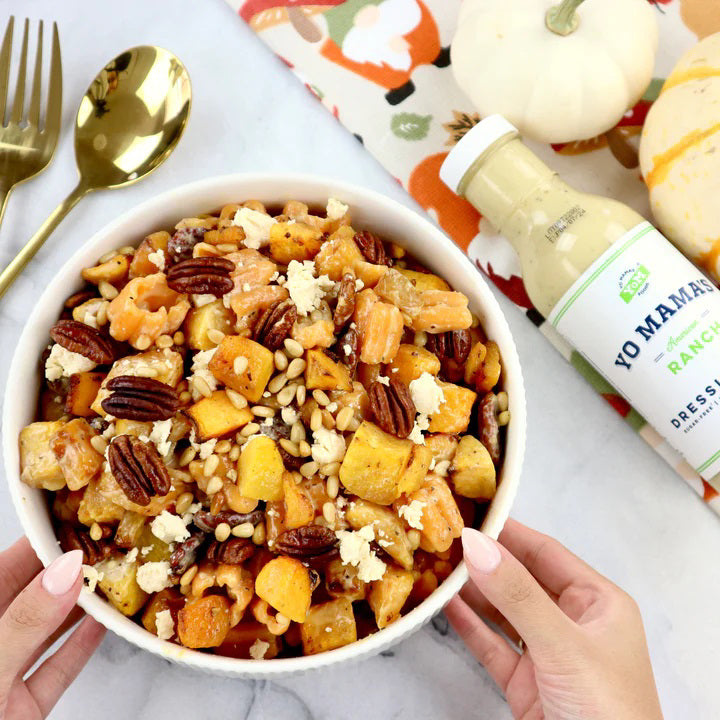 A bottle of YO MAMA'S - AMERICAN RANCH from YO MAMA'S FOODS is displayed against a white background. The green-capped bottle, labeled "dairy-free, gluten-free," and "no sugar added," contains 13 oz (368g) of hand crafted Ranch Dressing &amp; Dip.