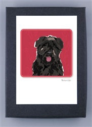 Introducing the PAPER RUSSELLS - BOUVIER NOTE CARDS by PAPER RUSSELLS: a delightful framed original illustration featuring a black dog with its pink tongue playfully sticking out, set against a vibrant red background. The artwork is elegantly displayed in a dark-colored frame with the image centered on a white mat, all printed on FSC certified recycled paper.