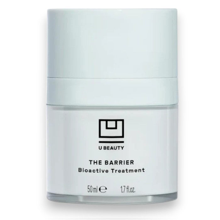 A white cylindrical 50ml jar of U BEAUTY THE BARRIER BIOACTIVE TREATMENT, featuring black text and the logo—a gel-cream overnight treatment that supports the skin’s moisture barrier.