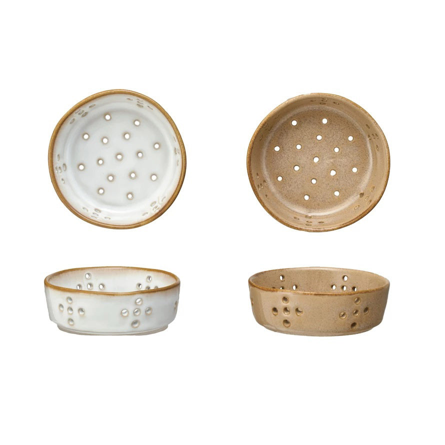 Four Creative Coop STONEWARE BERRY BOWLs, each measuring 4&quot; in diameter, are displayed against a white background. The two bowls on the left feature a white reactive glaze with brown rims, while the two on the right are entirely brown. Each pair includes both a top-down and side view of these ceramic colander bowls with holes.