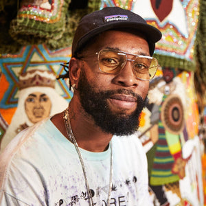 The CADDIS - HOOPER READERS by CADDIS are gold aviator sunglasses with premium, light green tinted lenses, a lightweight frame, and brown temple tips, shown facing forward on a white background.