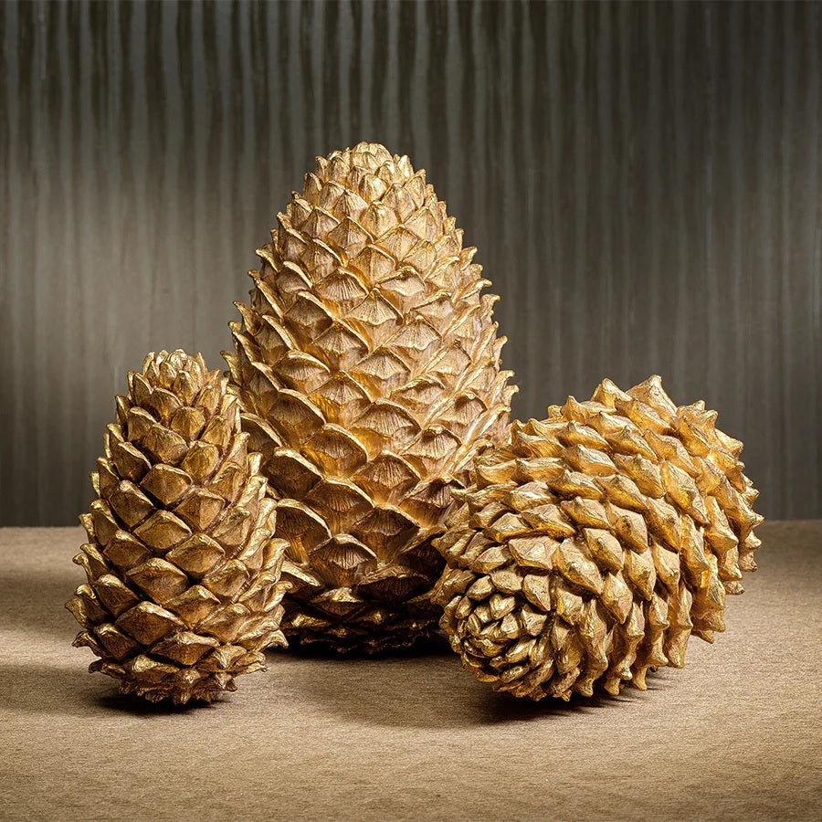 The LARGE GOLDEN PINECONE by ZODAX stands upright against a plain white background, making it a perfect addition to your holiday décor.