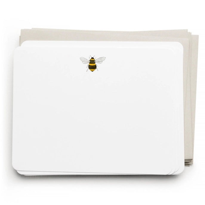 The E. FRANCES - FLAT NOTES BEE by E. FRANCES PAPER features illustrated bee stationery with a yellow honeycomb pattern on the back—perfect for hand-written notes. Set is pictured partially opened.