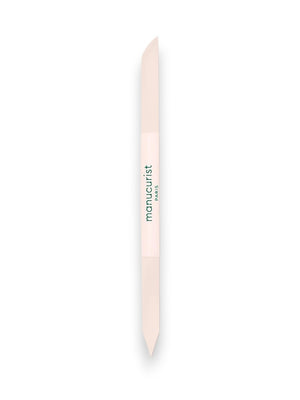 The MANUCURIST - GLASS CUTICLE PUSHER by MANUCURIST INC is a reusable, double-ended white glass cuticle tool with pointed tips and "manucurist PARIS" printed in green at the center, shown on a plain white background.